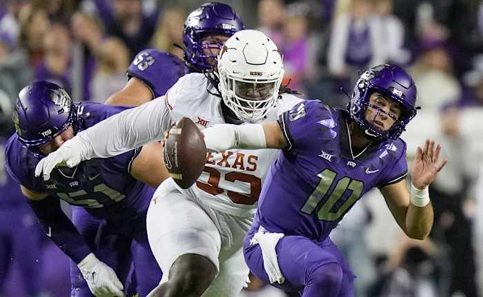 Texas Longhorns defensive lineman T'Vondre Sweat (93) sacks TCU Horned Frogs quarterback Josh Hoover (10) in the first quarter of an NCAA college football game, Saturday, November. 11, 2023, at Amon G. Carter Stadium in Fort Worth, Texas.  
